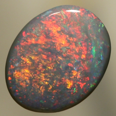 SOLID SEMI BLACK OPAL Red and orange moves constantly over green 